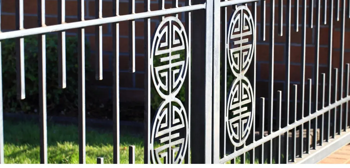 Decorative steel fence with laser-cut circular panels