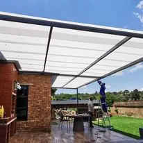 Recent job: steel patio roof with translucent sheeting being installed